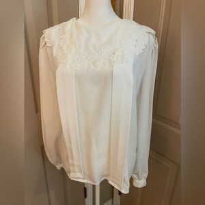La Blouse vintage white polyester bib-style collar long sleeve blouse. Size 10.